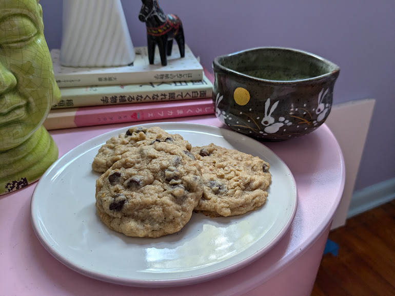 photo of my cookies on a pink table with a cup of matcha in my favorite/only matcha bowl featuring hopping in the moonlight